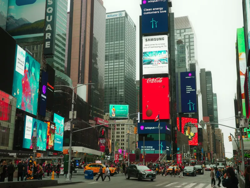 Times Square in New York City, bustling with activity and vibrant digital billboards.