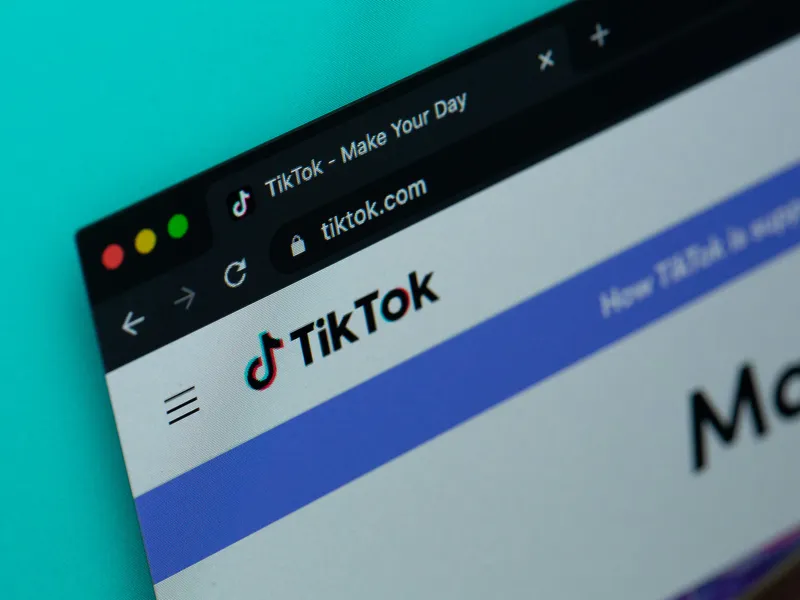 Close-up of TikTok website on a computer browser tab showing the TikTok logo and URL, highlighting the social media platform’s homepage and branding